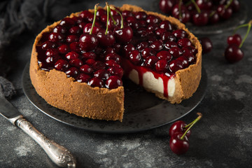 cherry cheesecake on cake stand