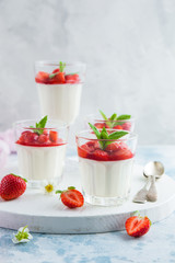 vanilla cream cheese and strawberry dessert on glasses