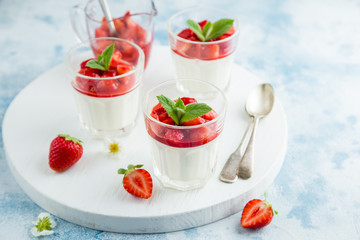 vanilla cream cheese and strawberry dessert on glasses