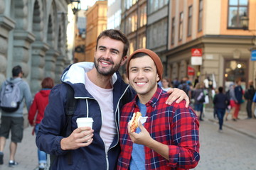 Beautiful homosexual couple  strolling the city streets 