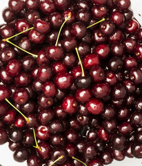 Freshly red cherry berries with water droplets. Healthy food background