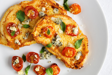 french toasts with cherry tomatoes, gorgonzola and parmesan cheese