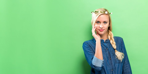 Happy young woman on a solid background