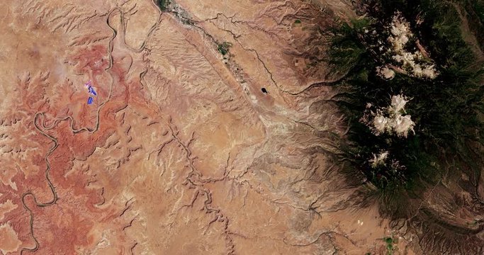 Very high-altitude overflight aerial of a section of Canyonlands National Park, Utah. Clip loops and is reversible. Elements of this image furnished by USGS/NASA Landsat