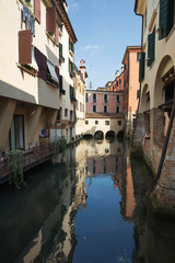 Fototapeta na wymiar Treviso / Waterfront view of the historical architecture and river canal