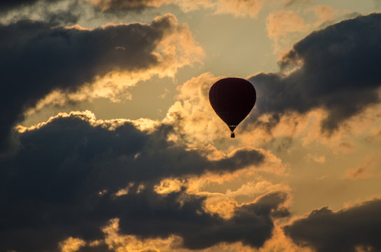 A balloon is flying among the clouds