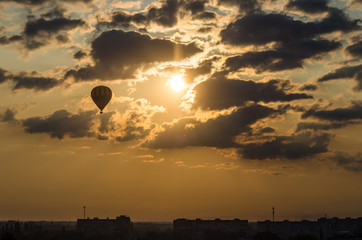 The balloon is flying in the sky