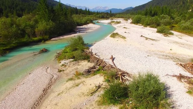 Camera flight over The Isar River that flows to Sylvenstein Lake in Bavarian Alps near Garmisch Partenkirchen. Germany, Central Europe. 