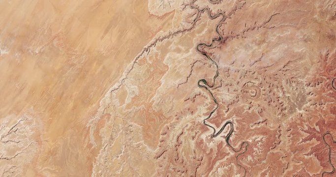 Very high-altitude overflight aerial of a section of Canyonlands National Park, Utah. Clip loops and is reversible. Elements of this image furnished by USGS/NASA Landsat