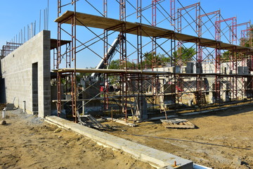 Commercial concrete block building under construction.