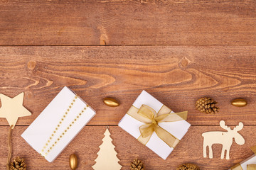 christmas background with decorations and gift boxes on wooden table, top view, copyspace