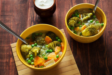 Vegetable detox soup with green peas and broccoli