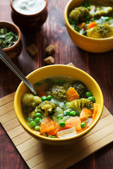 Vegetable soup with broccoli, carrots, green peas