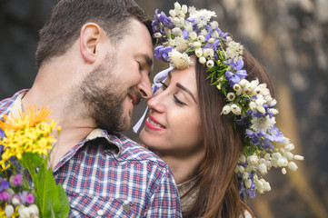 Young couple hipster hugging in nature