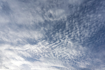 Naklejka na ściany i meble Strange clouds, blue sky