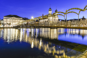 Liuzern with christmas lights reflected in the water - obrazy, fototapety, plakaty