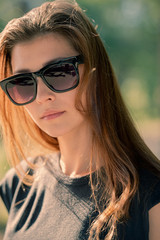 Cute girl in sunglasses with her hair loose.