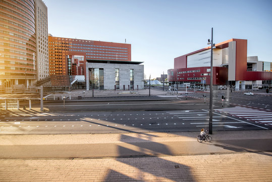 View on the street at the office district with modern theatre during the morning in Rotterdam city
