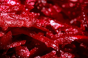 Background of grated beetroot, macro, soft focus