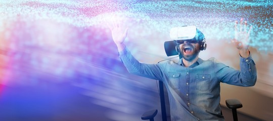 Composite image of cheerful man using virtual reality glasses