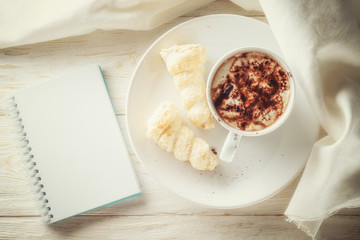 Sketchpad and a cup of hot cocoa