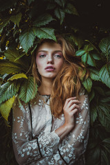 stylish hipster woman with fern leaf embracing. girl portrait with natural herb, boho sensual...