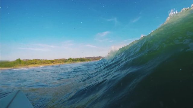 Surfing the ocean wave. POV