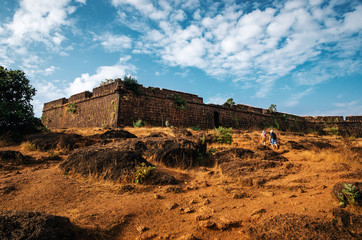 Tourists go to the ruins of Chapora fort, located near Vagator village, North Goa, India