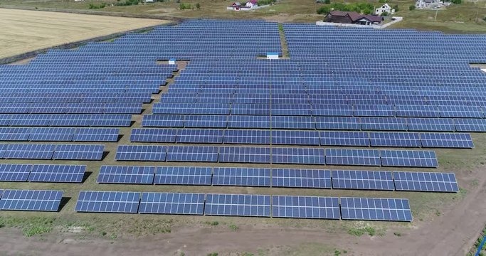 Panoramic view of a solar power plant, rows of solar panels, solar panels, top view, Aerial view to solar power plant, Industrial background on renewable resources theme, power station, top view,
