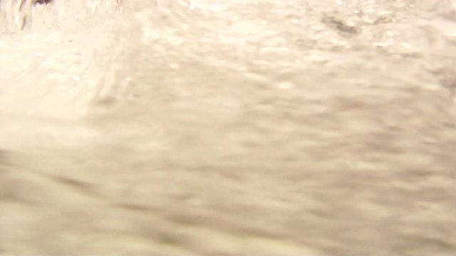 Underwater shot of propeller of powerful outboard engine.