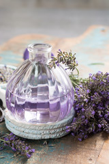 Obraz na płótnie Canvas Nature cosmetics, handmade preparation of essential oils, parfums, creams, soaps from fresh and dried lavender flowers, French artisan home style