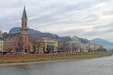 View of Salzburg with Salzach river in winter, Austria — Stock Photo #165336540 View of Salzburg with Protestant parish Salzburg Christ Church and Salzach river in winter, Salzburg, Salzburger Land, A