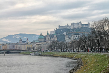 Fototapeta premium View of Salzburg with Salzach river in winter, Austria