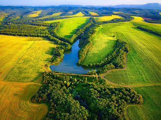 Aerial view of fields with lake in Krasnodar