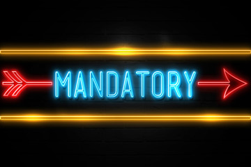 Mandatory  - fluorescent Neon Sign on brickwall Front view