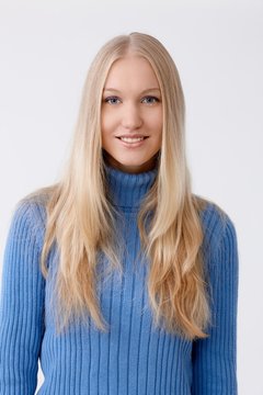 Portrait of young blonde woman smiling