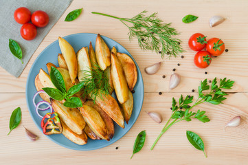 Baked potatoes on a plate on a wooden table