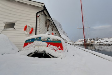 Small fishing boats ashore upon wooden pier-harbor's W.side. Hamnoy-Reine-Lofoten-Norway. 0365
