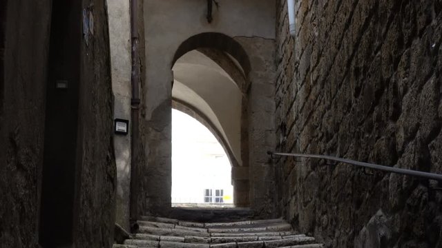 view of empty old italian street of small town with the staircase
