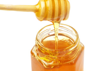 Fototapeta na wymiar honey in a jar on a white background