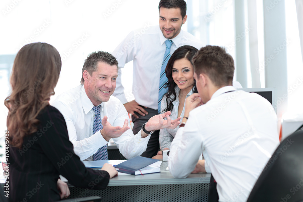 Wall mural picture of smiling attractive business man working in office