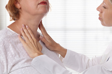 Woman getting thyroid gland control. Health care and medical concept