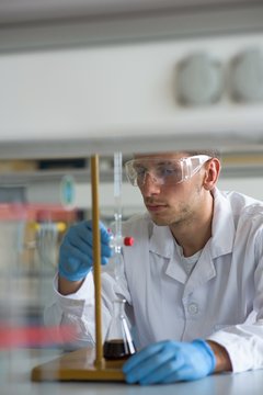 Male student practicing experiment