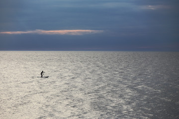 SUP surfer at sea