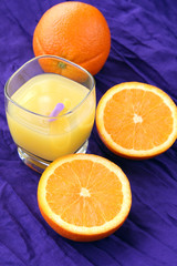 delicious orange juice breakfast drink: oranges and freshly squeezed glass of juice