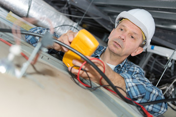 electricians working on an electric meter