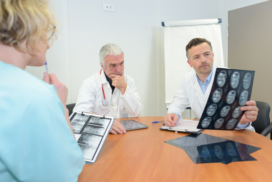 doctors looking at x-ray