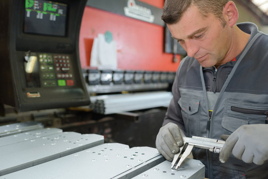 industrial man technician worker checking machine