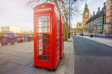 Fototapeta na wymiar London, England - Traditional British red telephone box at Victoria Embankment with Big Ben at background