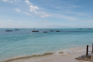 Fototapeta na wymiar Dhows anchored off the Nungwi Beach in Zanzibar
